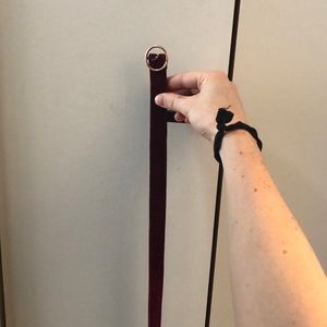 Maroon velvet belt with gold accents